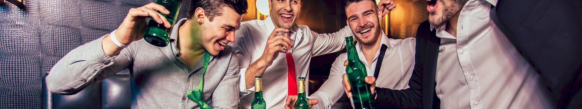 Four men enjoying beers together