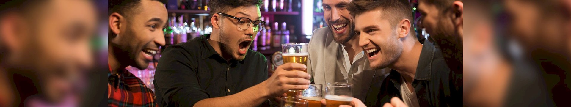 A group of guys enjoying some beers on a boozy stag do night out