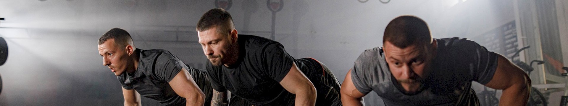 3 men doing push ups, preparing for their active stag do