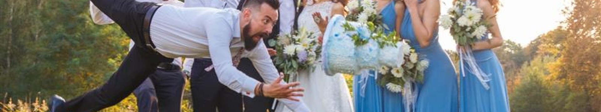 a man at a wedding jumping in front of the bouquet toss as a prank