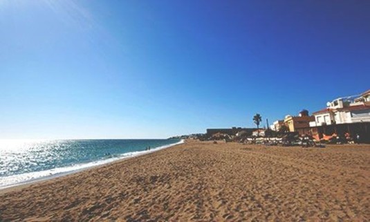 Sun shining on Fuengirola Beach. Explore Fuengirola Stag Party ideas below: